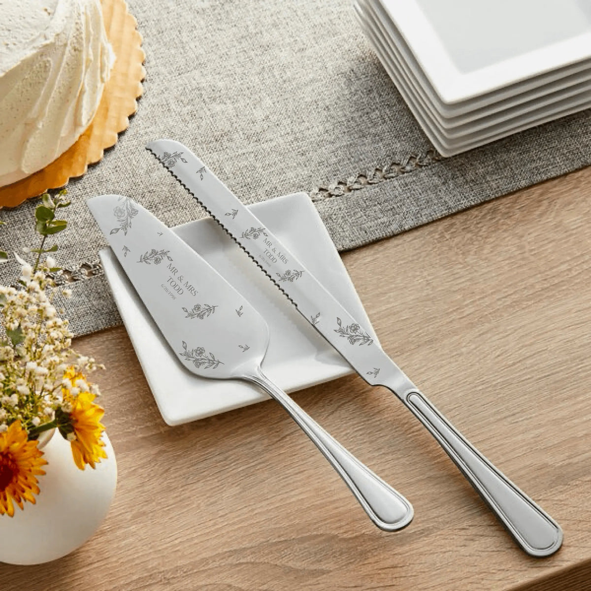 Personalized cake serving set with two stainless steel utensils, featuring engraved handles, by Winks Design Studio, LLC