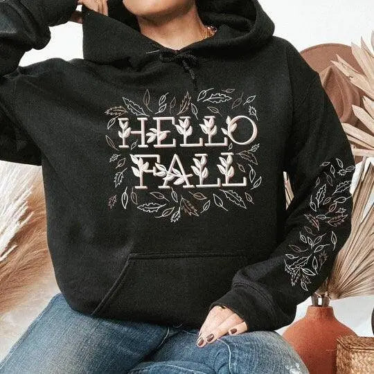 Winks Design Studio LLC Hello Fall hoodie featuring a cozy design, perfect for fall weather, displayed on a mannequin.