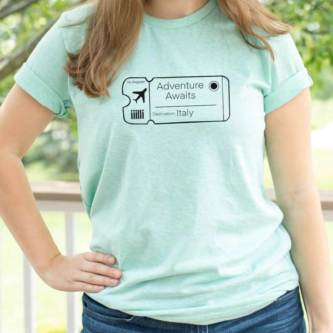 White Adventure Awaits custom shirt by Winks Design Studio, LLC featuring a casual design for men and women.