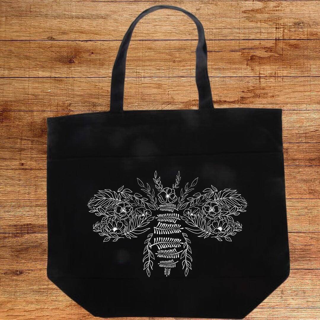 Flower Bee Tote Bag by Winks Design Studio, LLC, a stylish shopping tote with floral and bee design, made of durable fabric.