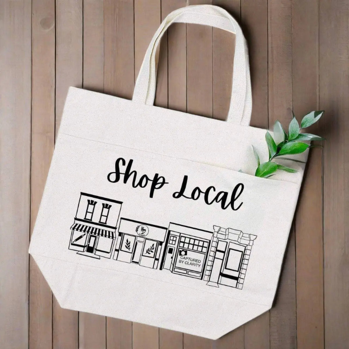 Winks Design Studio LLC Shop Local canvas tote bag with black handles and "Shop Local" printed on natural-colored fabric.