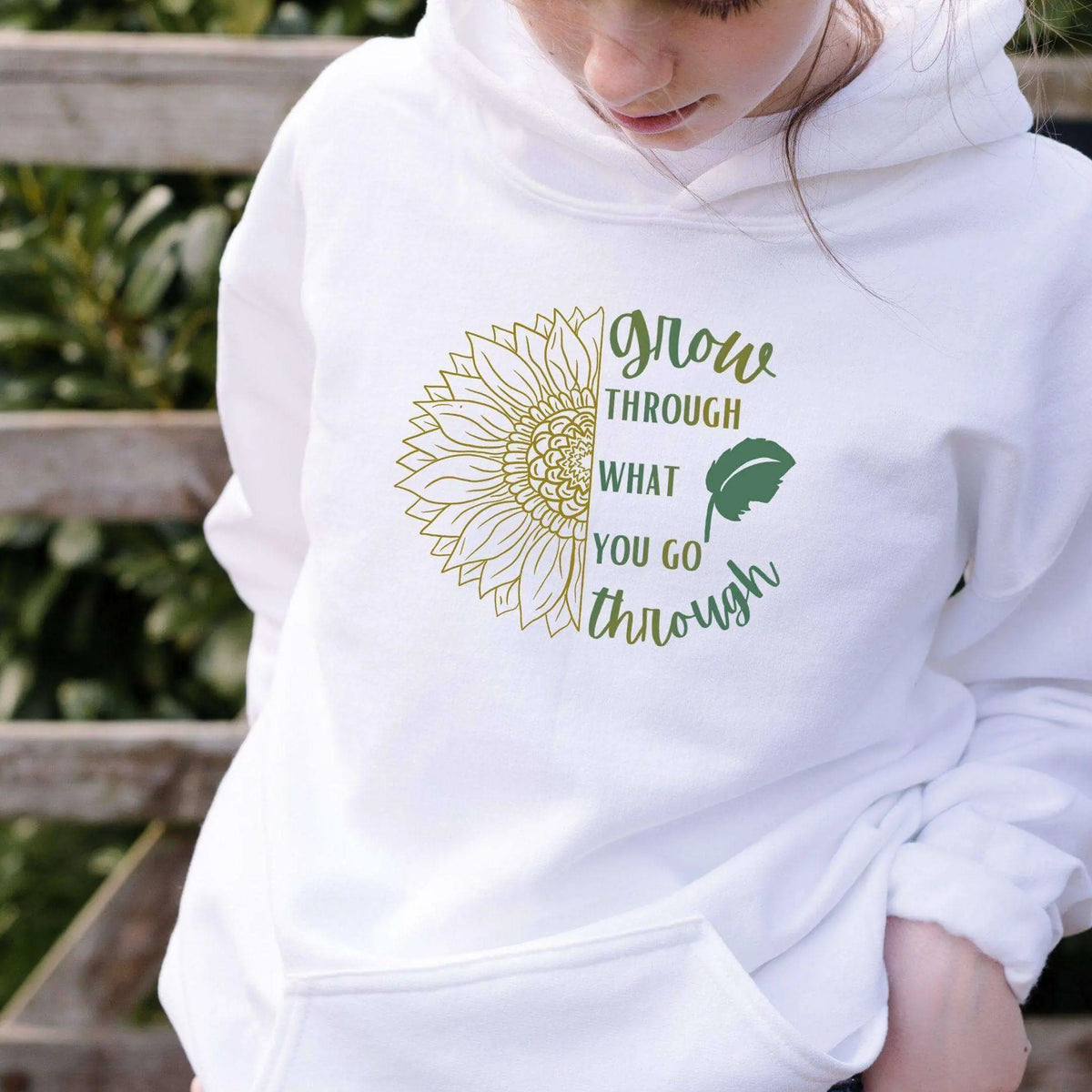 Winks Design Studio LLC sweatshirt with "Grow Through What You Go Through" printed design on soft fabric.