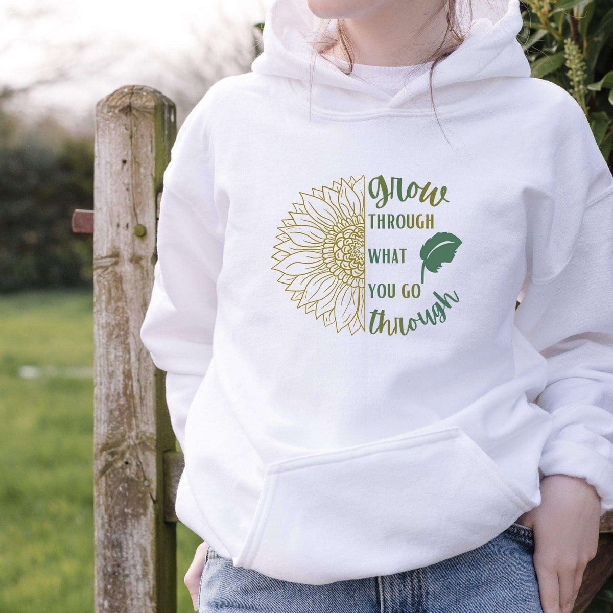 Winks Design Studio LLC sweatshirt with "Grow Through What You Go Through" slogan, soft fabric, and comfortable fit.