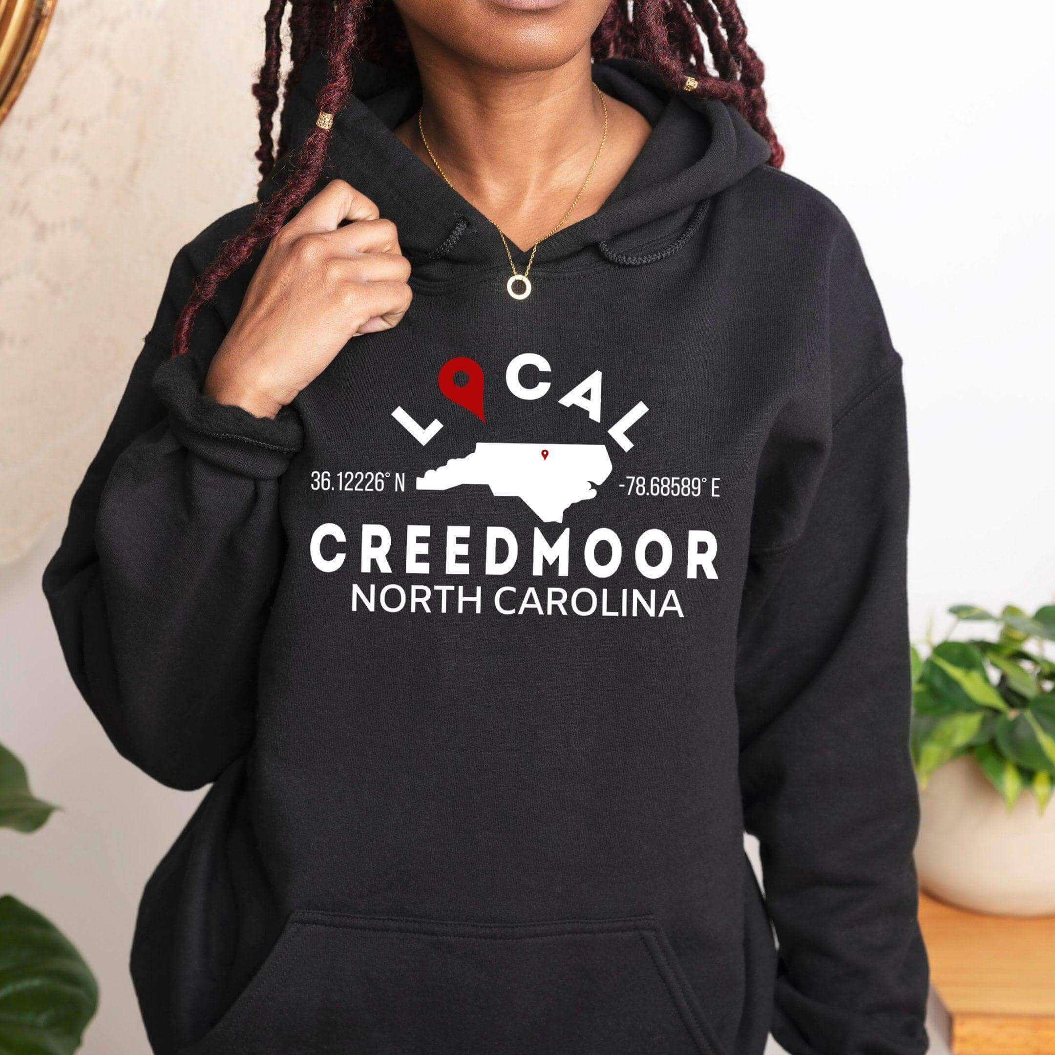 Tan custom city and state sweatshirt hoodie by Winks Design Studio, LLC featuring a small, printed geographic design.