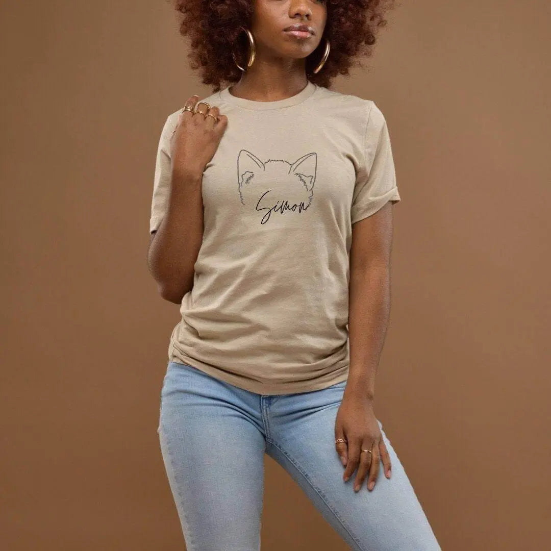 Black T-shirt from Winks Design Studio, LLC featuring a custom pet ear outline design on the front.