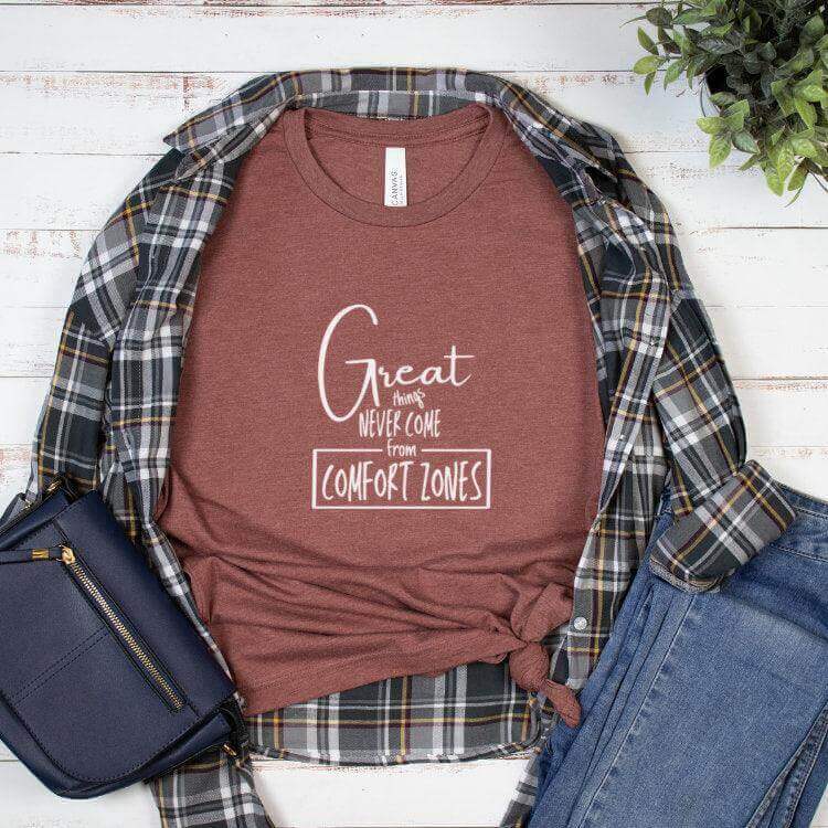 Black Winks Design Studio LLC T-shirt with "Great Things Never Come From Comfort Zones" printed on the front. Small size.