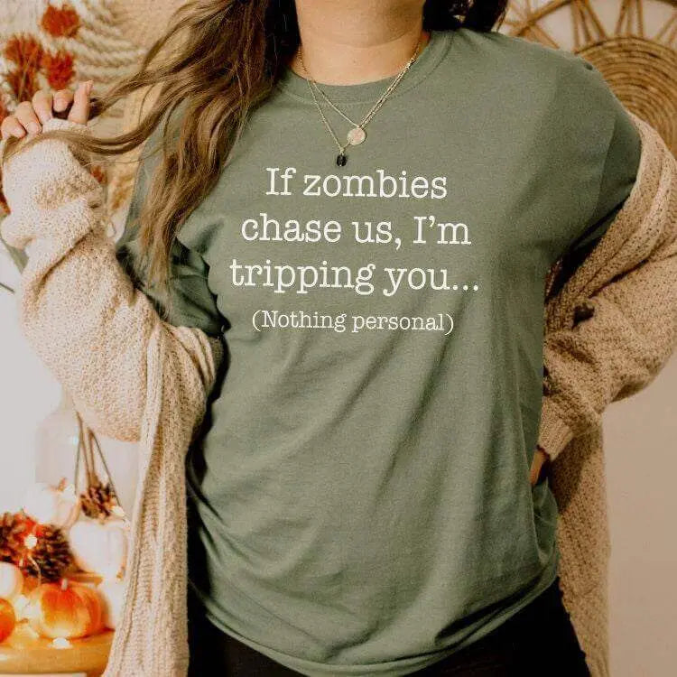 Black T-shirt from Winks Design Studio LLC featuring the humorous "If Zombies Chase Us I&