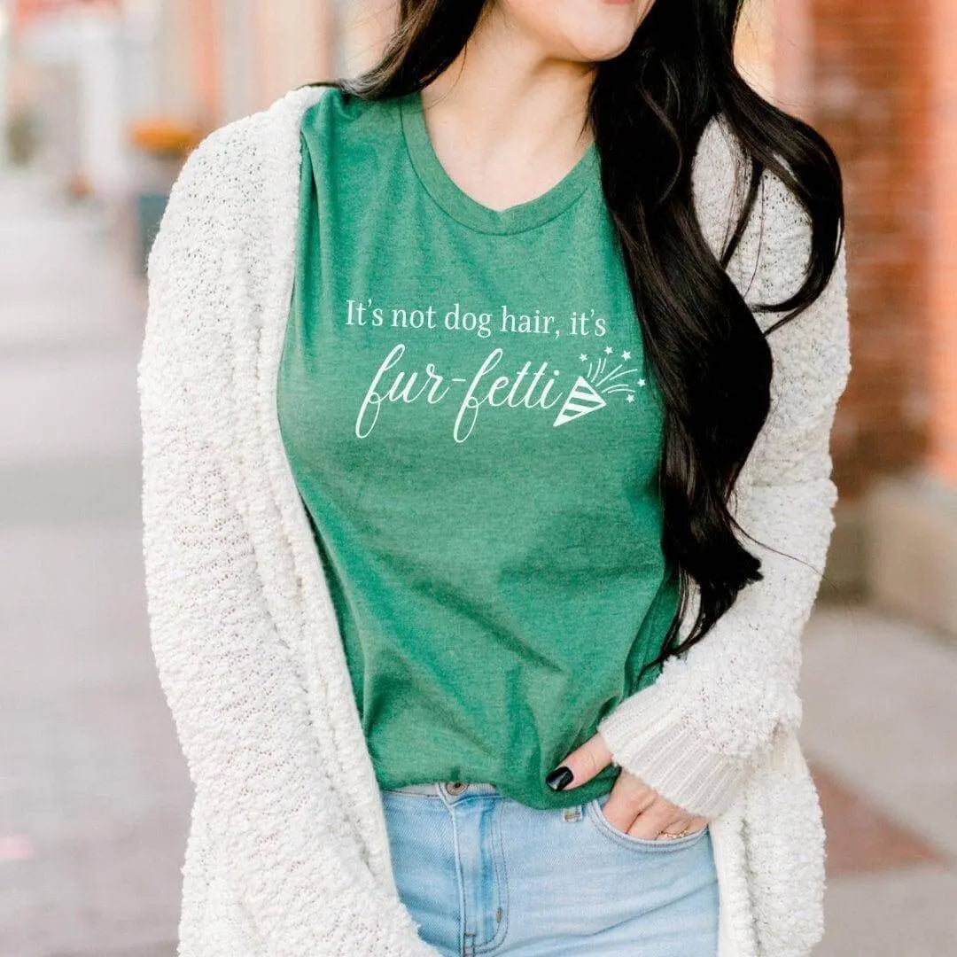 Black T-shirt from Winks Design Studio LLC featuring the "It’s Not Dog Hair, It’s Fur-fetti" slogan in white text.