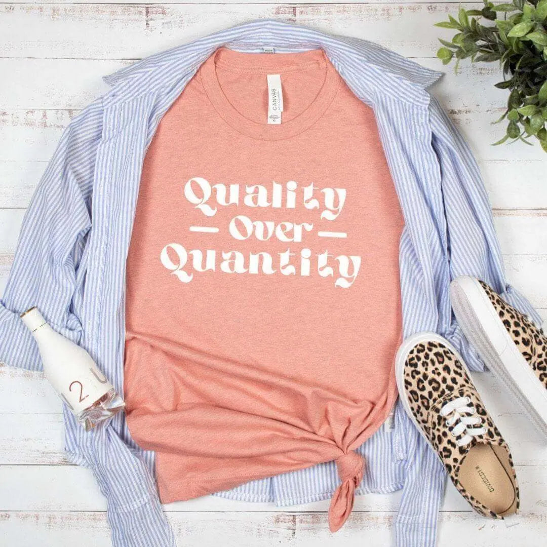Black Winks Design Studio LLC Quality Over Quantity T-shirt, small size, soft cotton fabric, casual fit, front graphic design.
