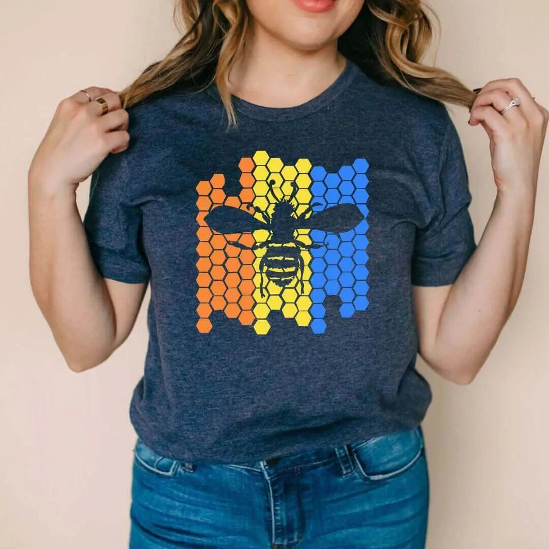 Blue Color Blocked Bee Graphic Tee by Winks Design Studio, LLC, featuring a vibrant bee illustration on the front.