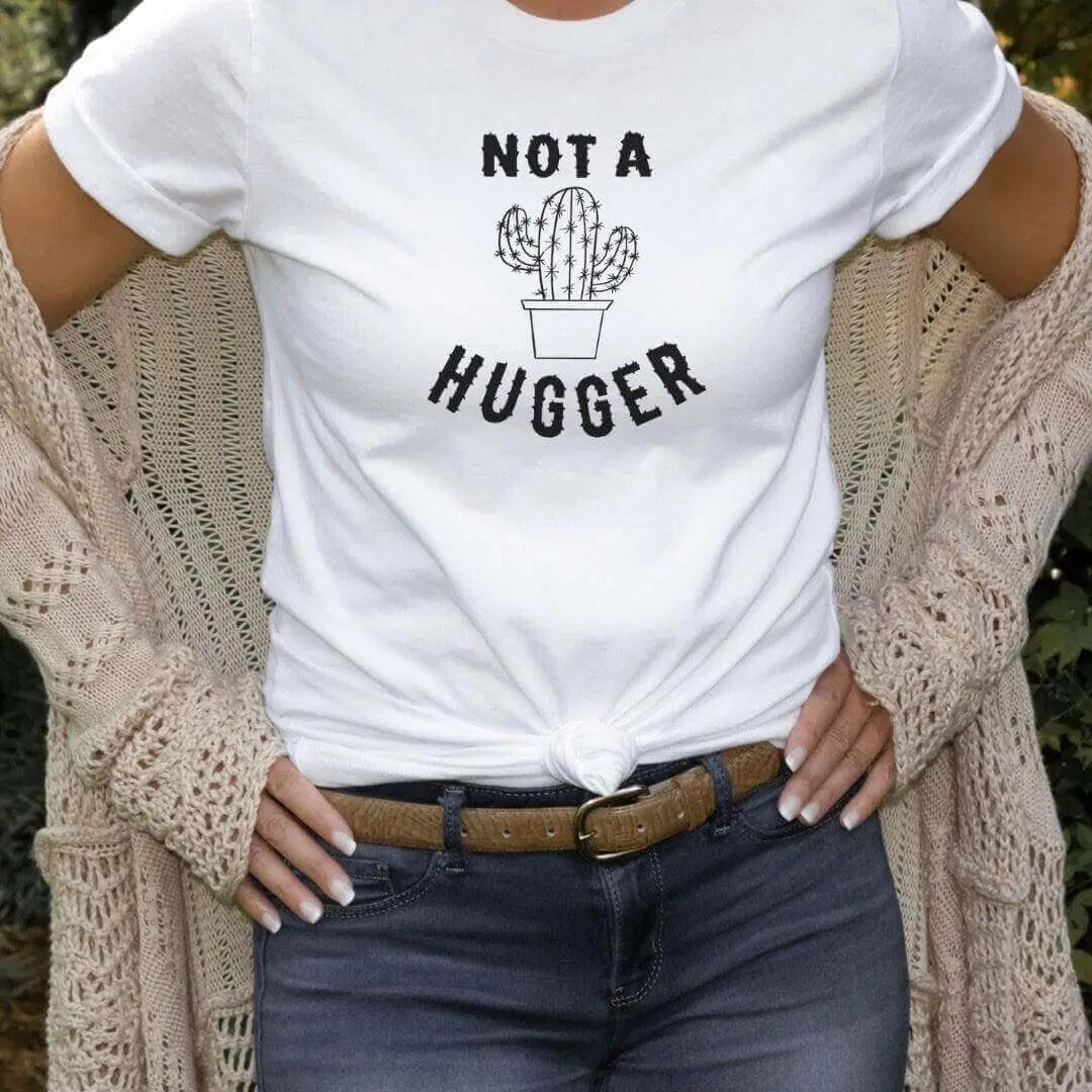 Mint green Not A Hugger Funny Cactus T-Shirt by Winks Design Studio, LLC, featuring a playful cactus graphic on the front.