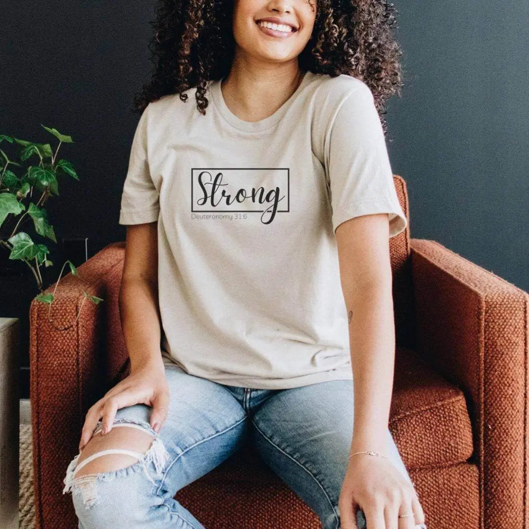 Peach Deuteronomy 31:6 T-shirt by Winks Design Studio, LLC featuring a biblical verse and simple design on a small-sized tee.