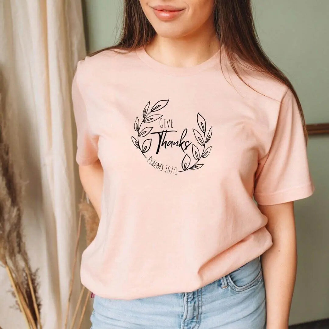 Peach Give Thanks Psalm 107:1 T-shirt by Winks Design Studio, LLC featuring a cute Christian design and small print.