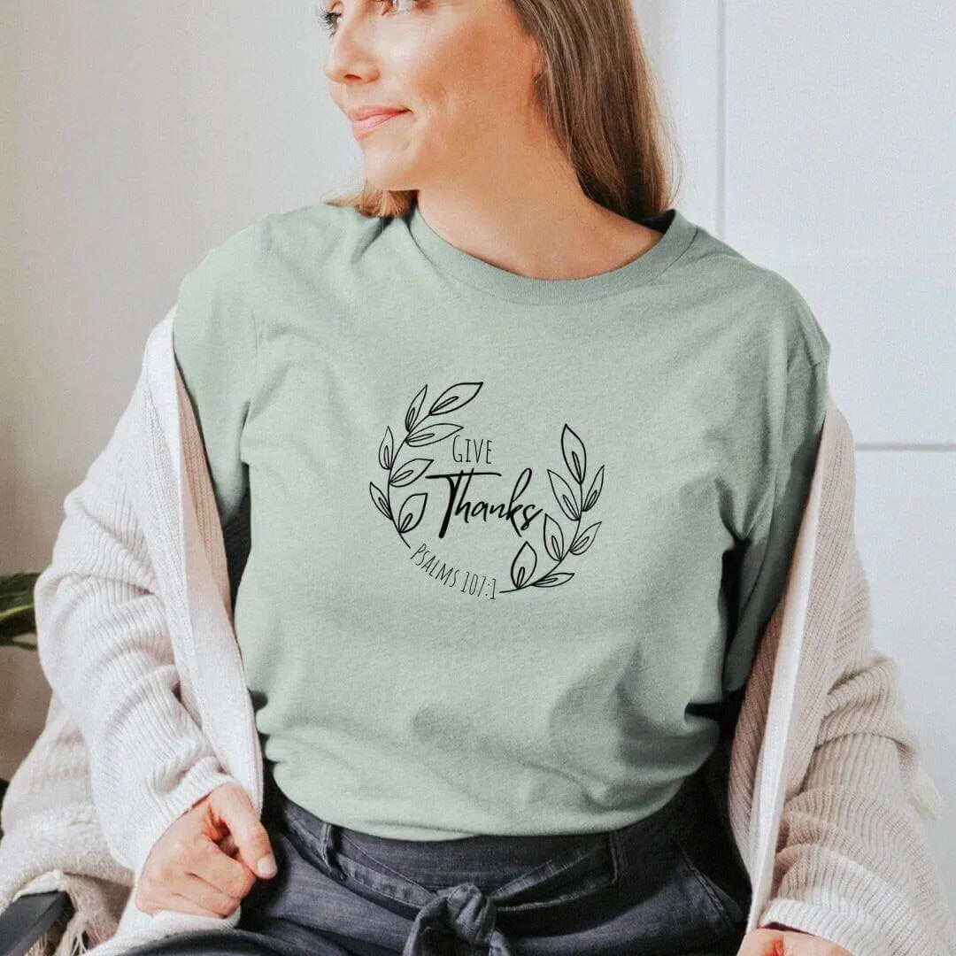Peach Give Thanks Psalm 107:1 T-shirt from Winks Design Studio, LLC featuring a cute Christian design and small print.