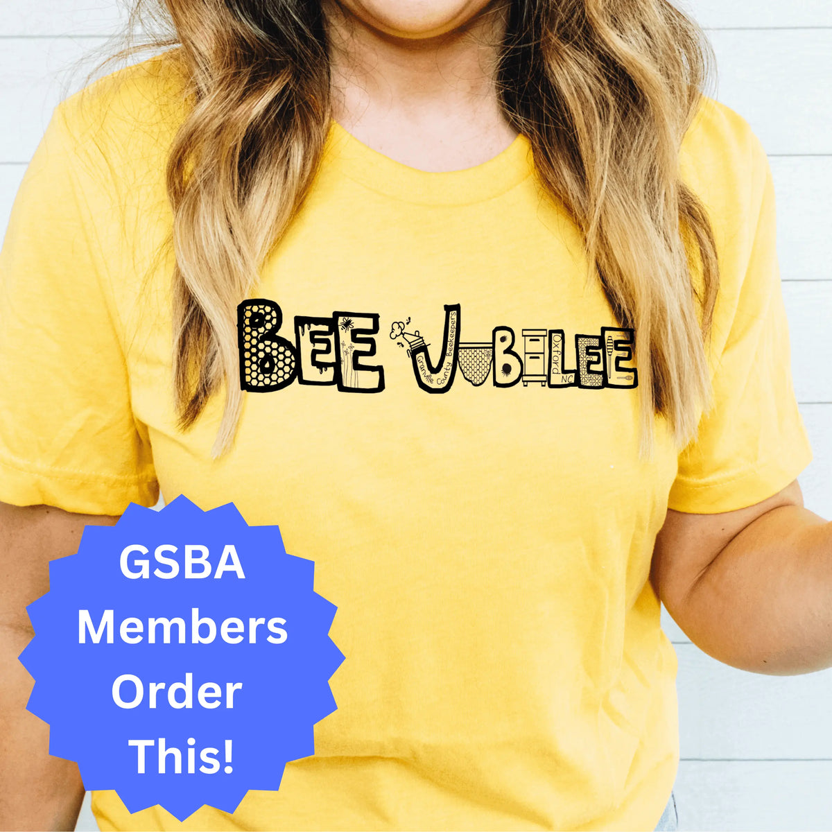Bee Jubilee STAFF short sleeve T-shirt by Winks Design Studio, LLC featuring a colorful bee Jubilee design on the front.
