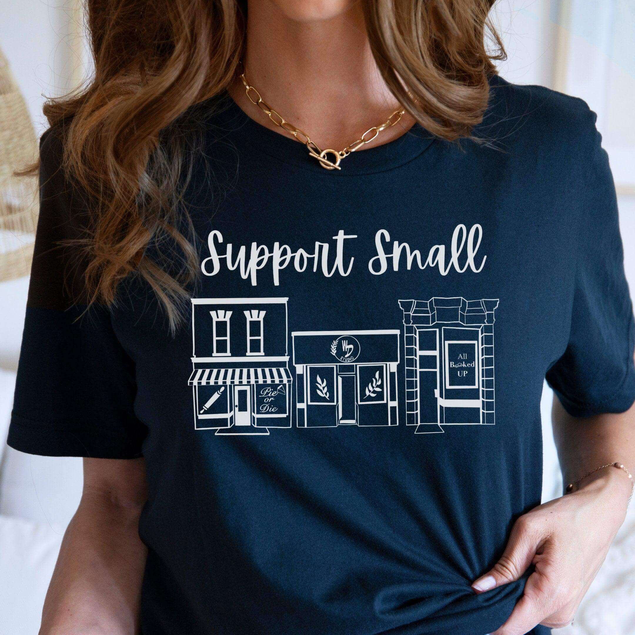 Blue crewneck T-shirt by Winks Design Studio LLC with "Support Small Business" slogan, casual fit and soft fabric.