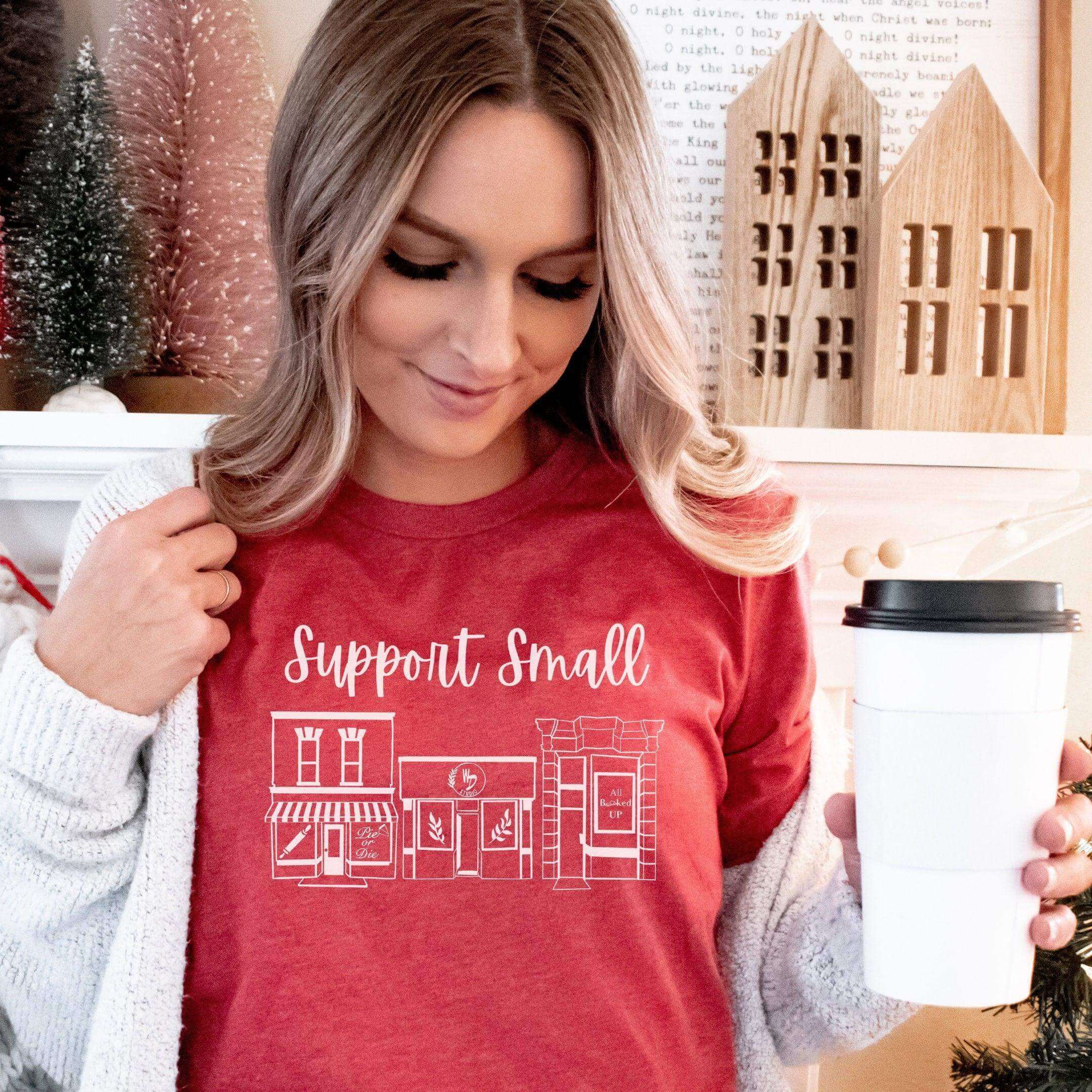 Blue crewneck T-shirt from Winks Design Studio LLC with "Support Small Business" slogan, casual fit and soft fabric.