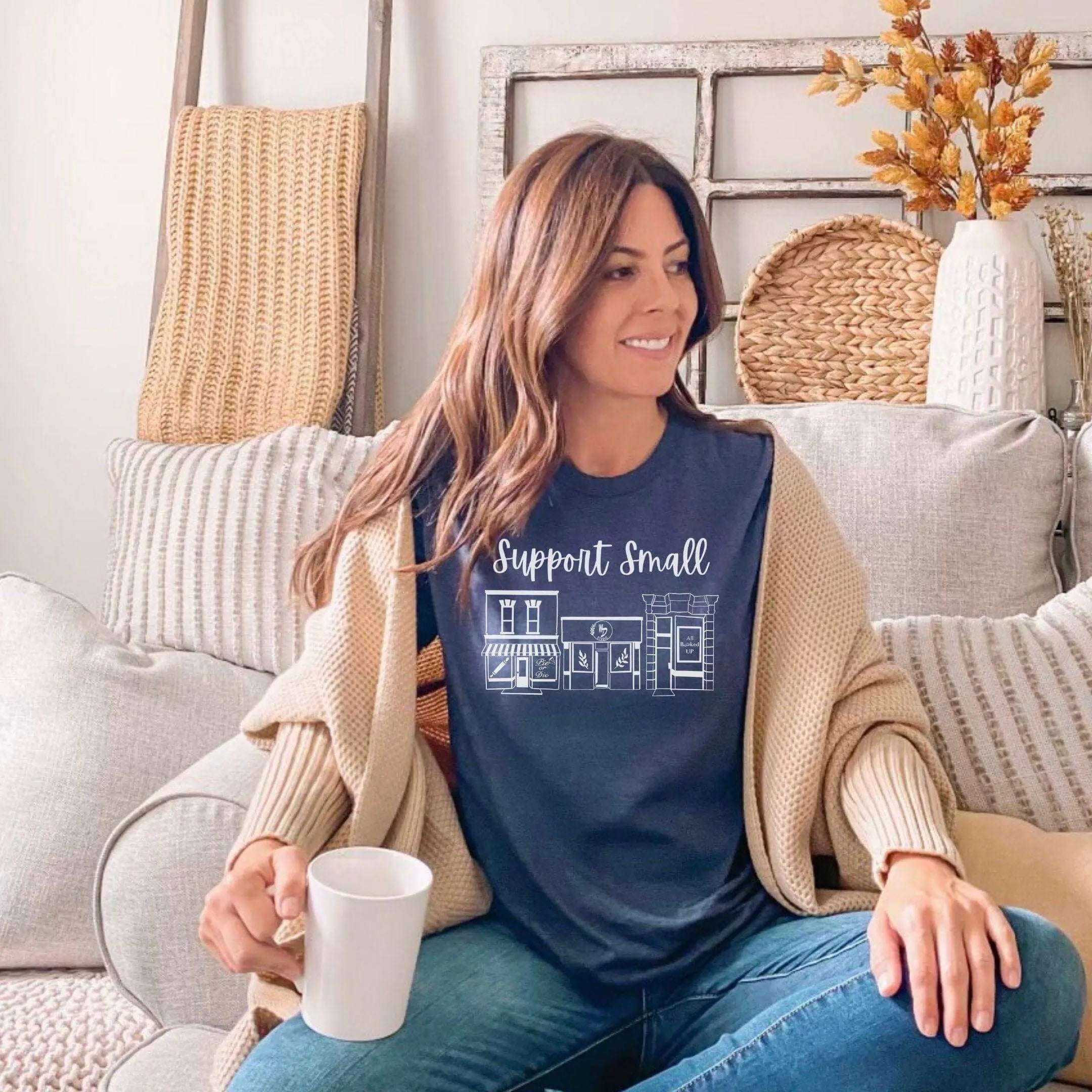 Blue crewneck T-shirt from Winks Design Studio LLC featuring "Support Small Business" design.
