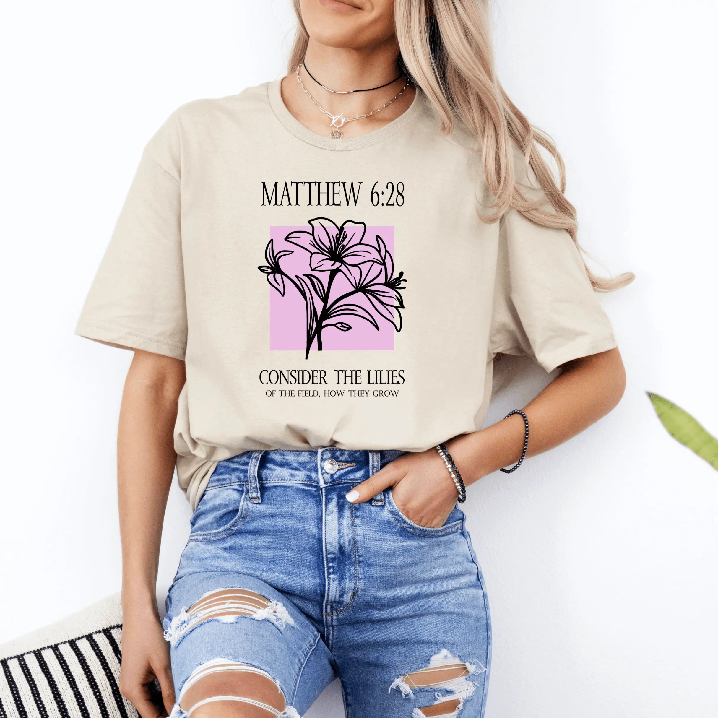 Winks Design Studio LLC Consider the Lilies T-shirt featuring a floral lily print on a casual cotton T-shirt.