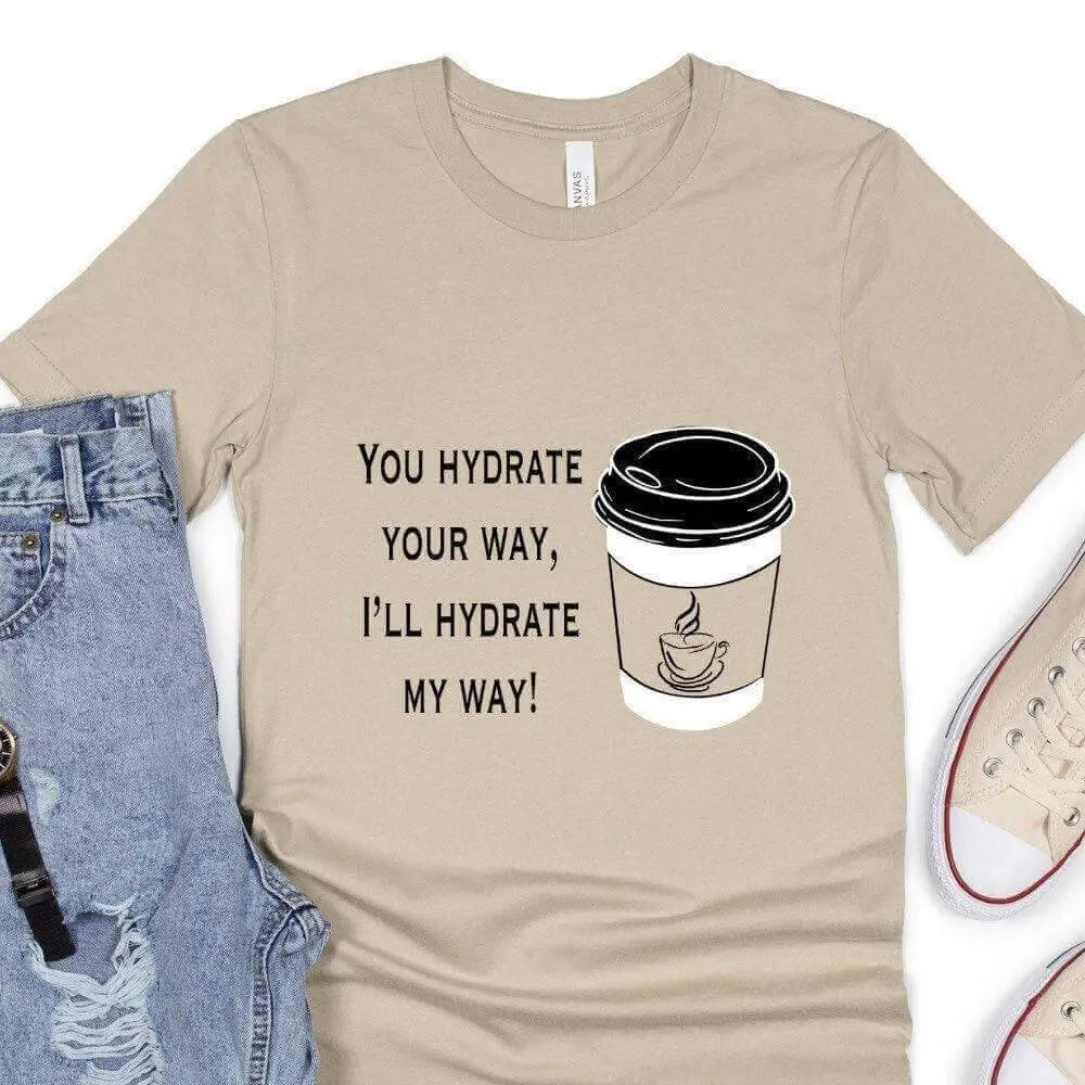 Funny coffee T-shirt by Winks Design Studio, LLC featuring a humorous "You Hydrate Your Way" graphic on a casual T-shirt.