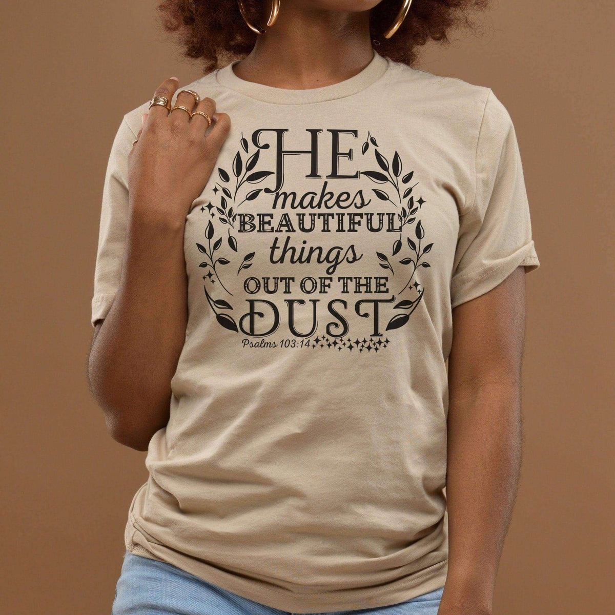 Winks Design Studio LLC He Makes Beautiful Things Out of The Dust T-shirt featuring printed text on a casual cotton T-shirt.