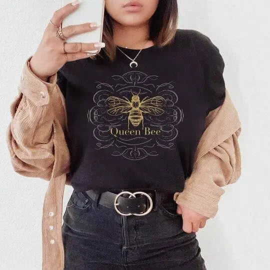 Winks Design Studio Queen Bee T-Shirt featuring a stylish bee graphic on a comfortable cotton T-shirt.