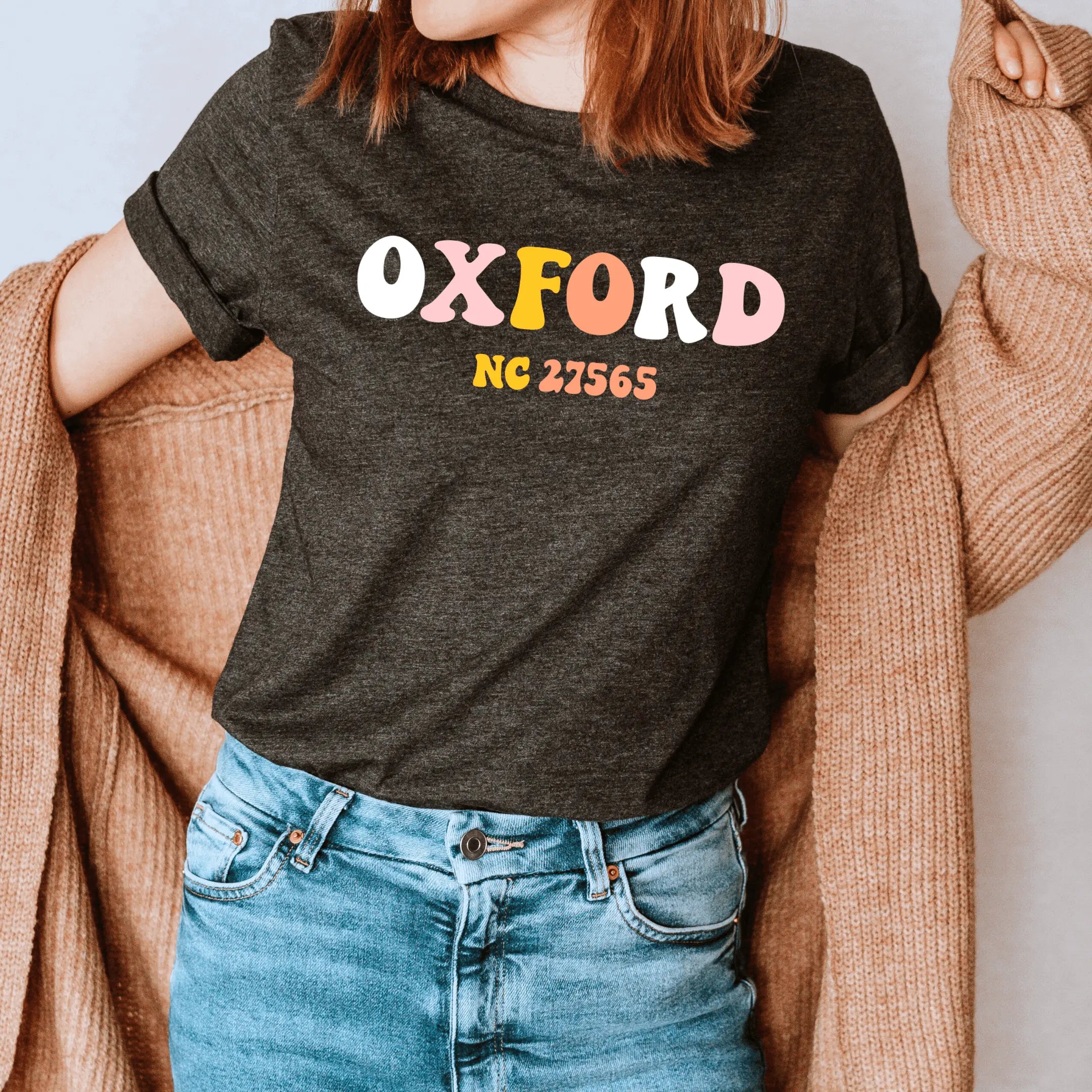 Retro Oxford T-shirt by Winks Design Studio, LLC featuring a classic design and casual fit, shown in a small size.