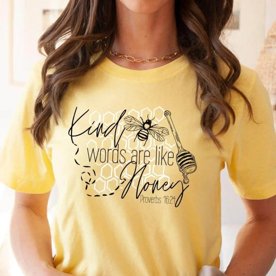 Winks Design Studio LLC SCBA T-shirt featuring Proverbs 16:24 "Kind Words Are Like Honey" with floral design on white fabric.
