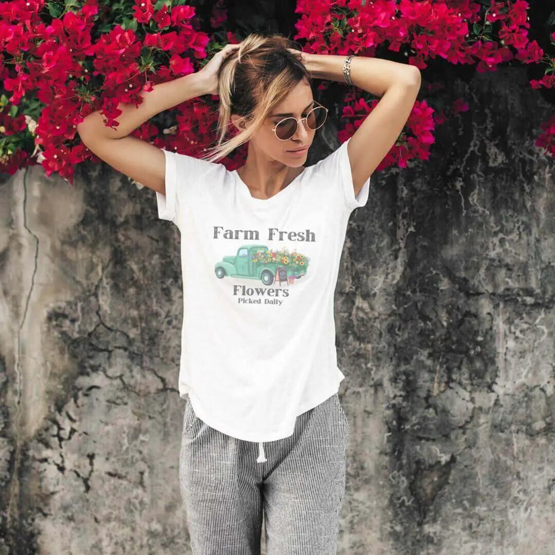 Vintage Flower Truck T-Shirt by Winks Design Studio, LLC, featuring a colorful floral truck graphic on a casual T-shirt.