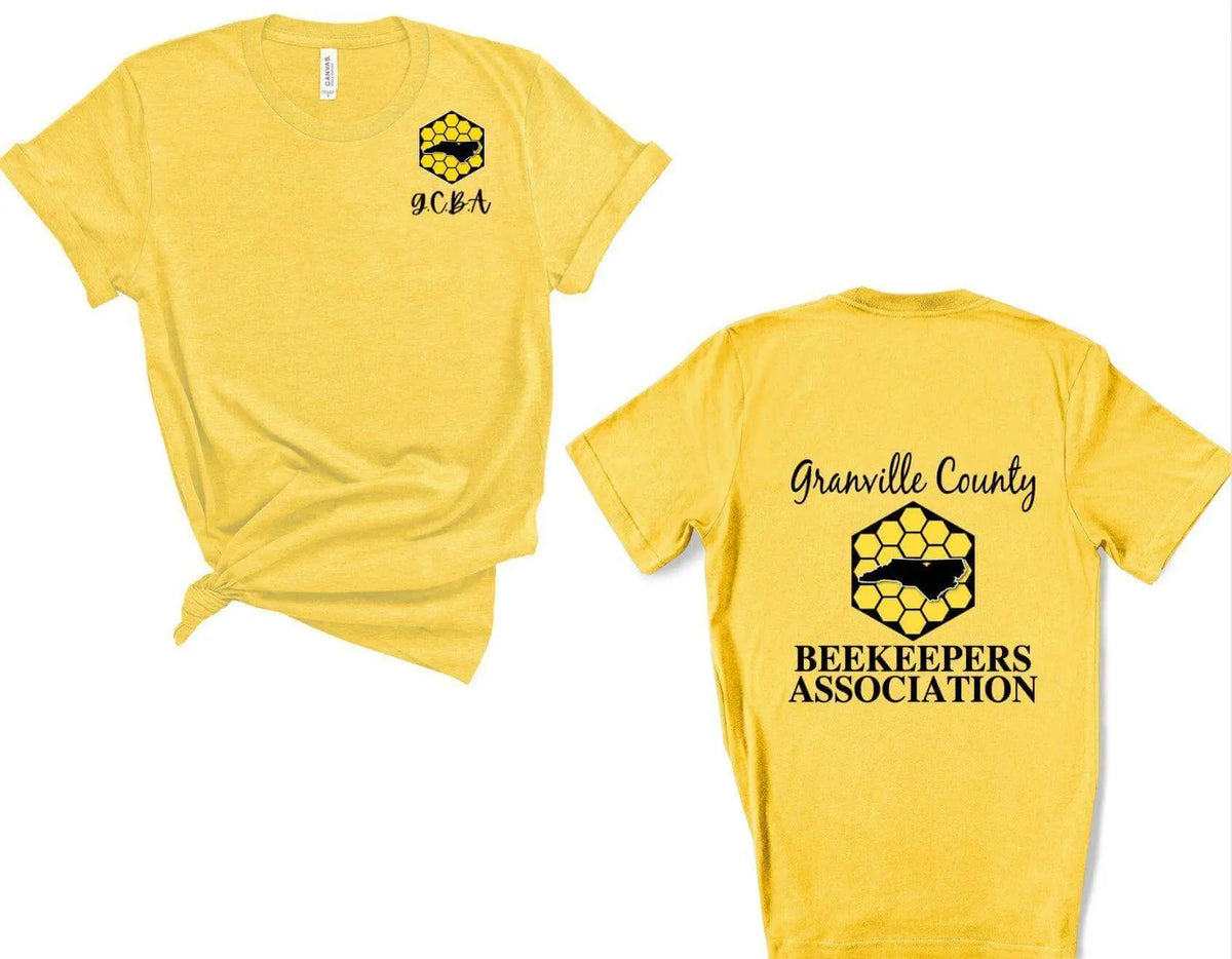 White GCBA Pocket Image and Full Back Logo T-shirt by Winks Design Studio, LLC, featuring a front pocket and back logo design.