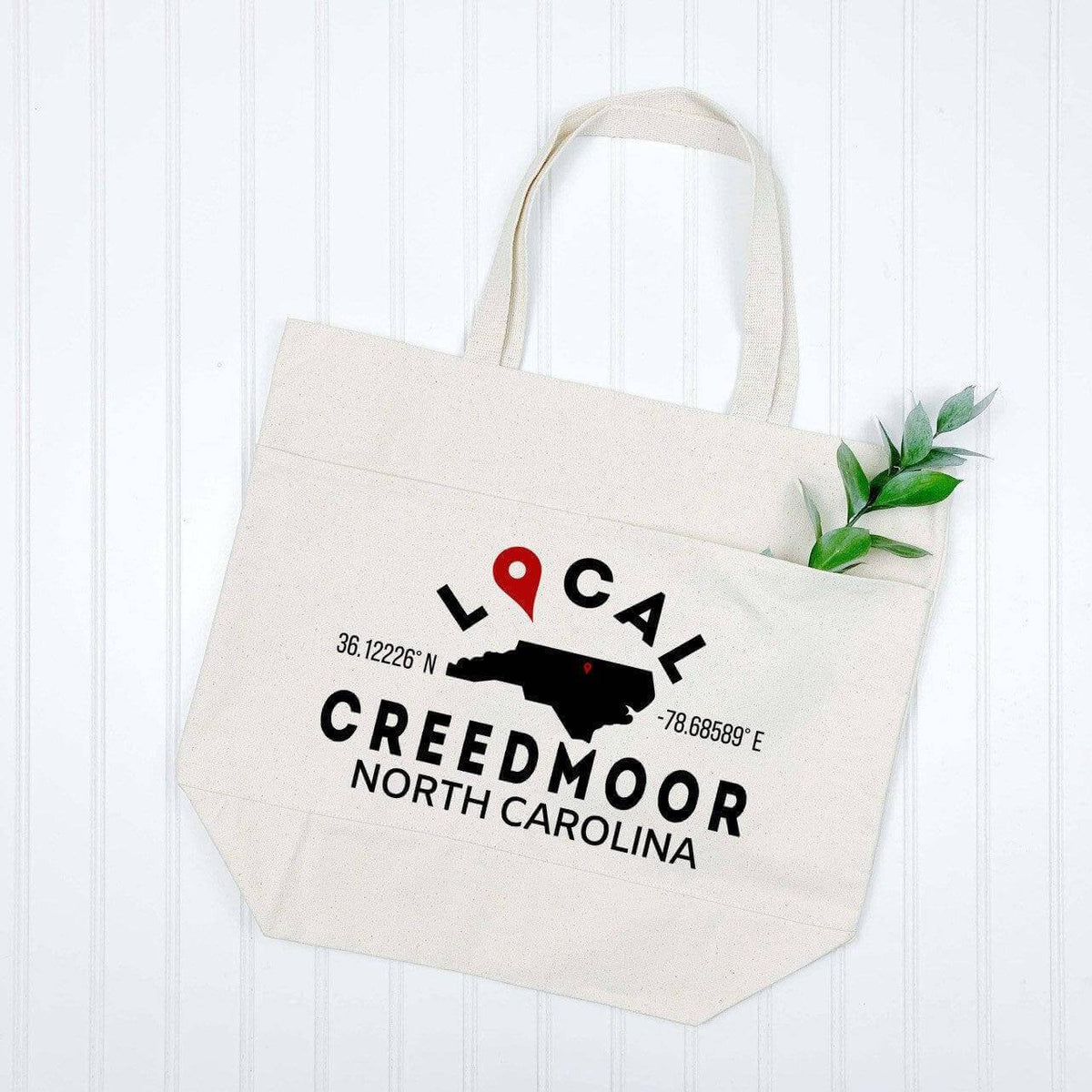 Black custom city and state tote bag by Winks Design Studio, LLC with personalized design and sturdy handles.