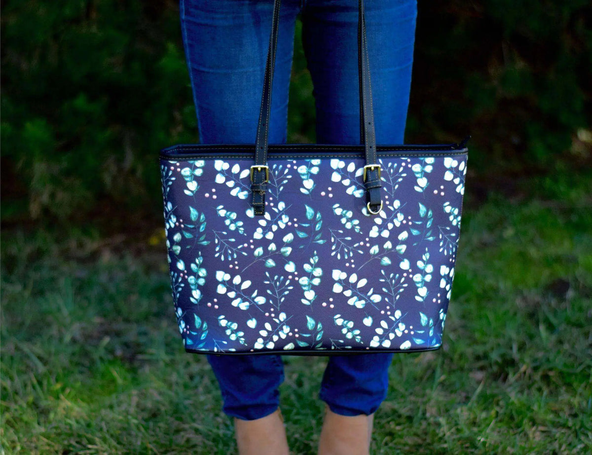 Eucalyptus leather tote bag by Winks Design Studio, LLC with sturdy handles and spacious interior for everyday use.