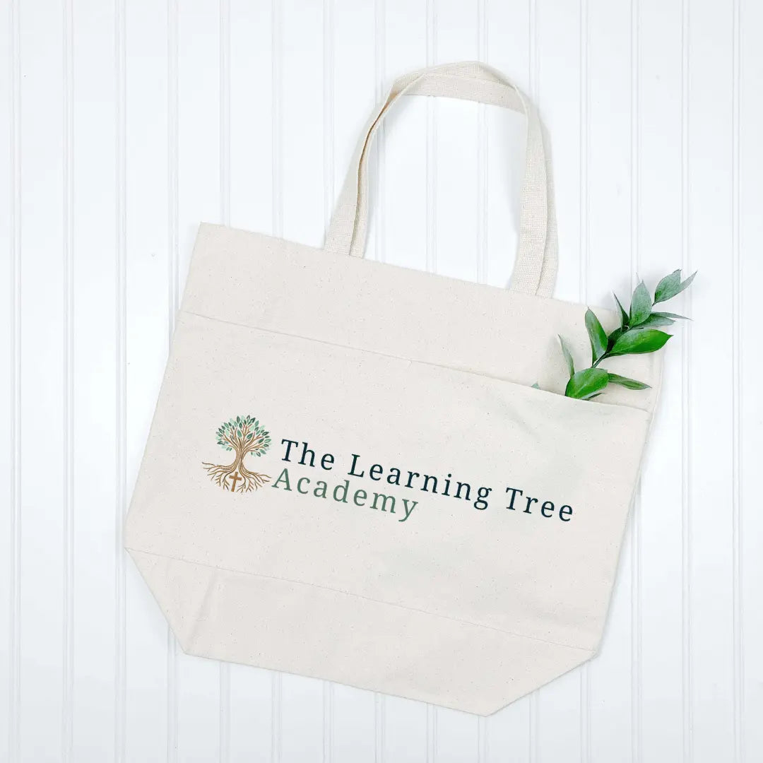Winks Design Studio LLC tote bag featuring The Learning Tree Academy logo and design, made of durable fabric for everyday use.