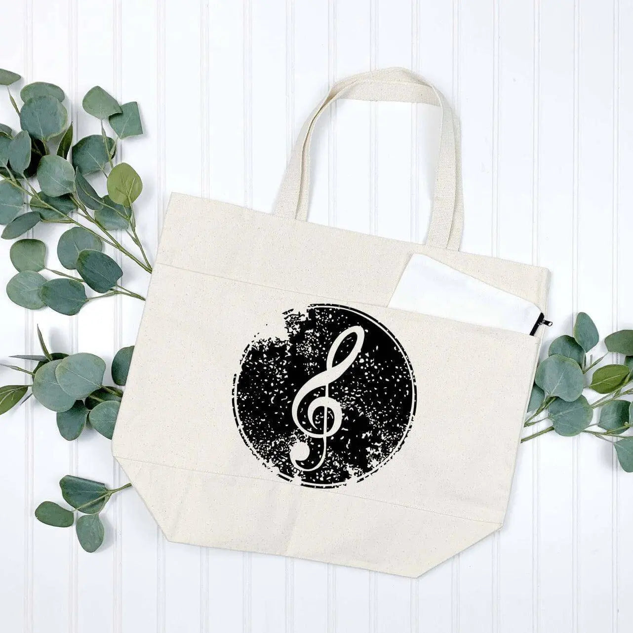 Cotton canvas tote bag with treble clef design and multiple pockets by Winks Design Studio, LLC.