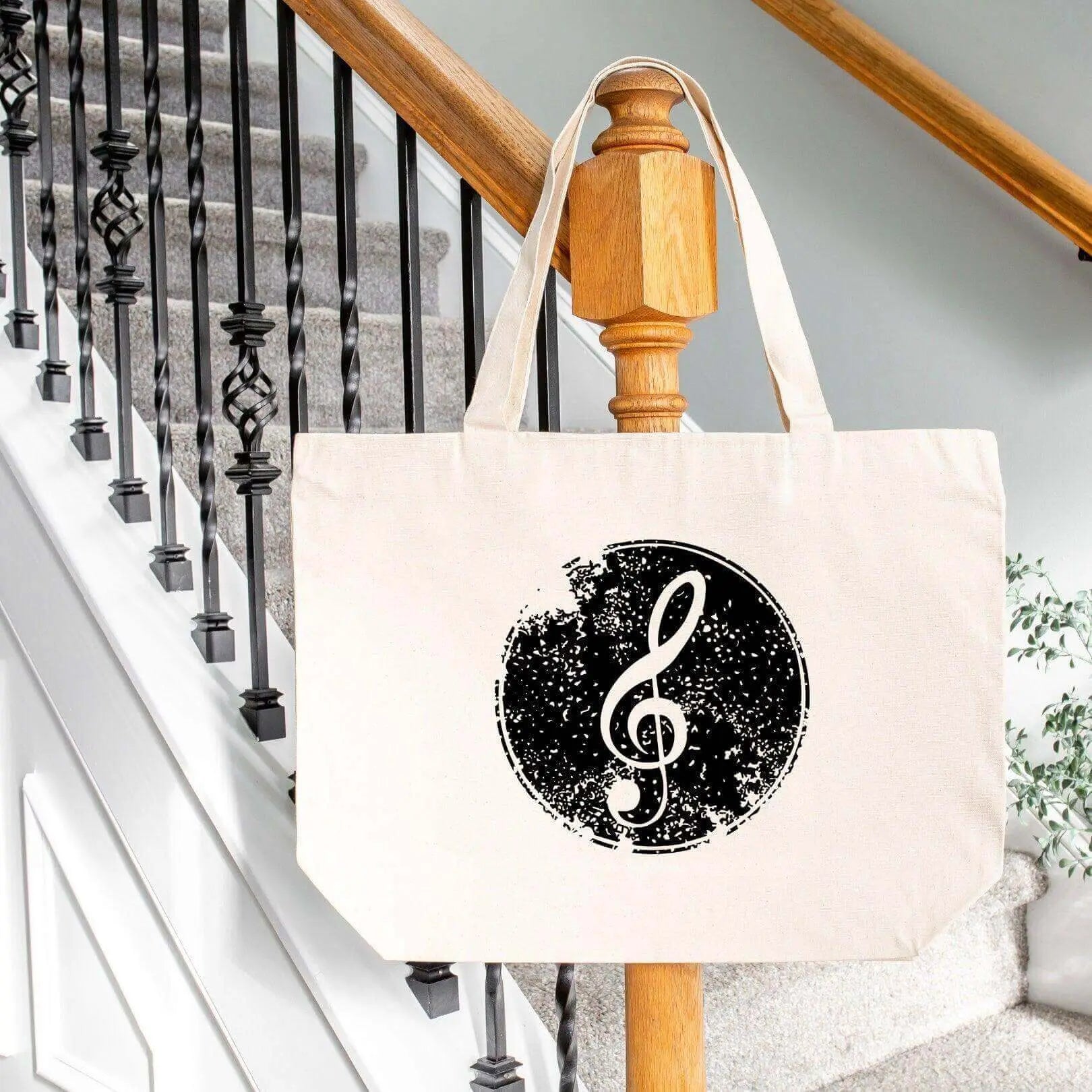 Cotton canvas tote bag with treble clef design and front pockets, by Winks Design Studio, LLC.