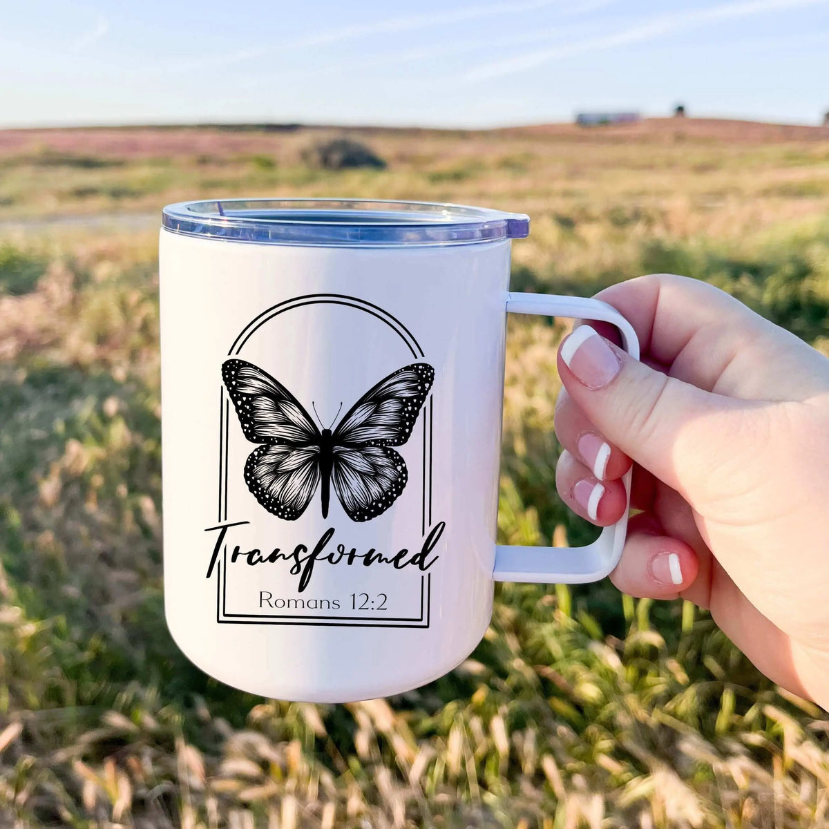 Winks Design Studio LLC 13oz tumbler with Romans 12:2 Transformed Butterfly design featuring a colorful butterfly illustration.