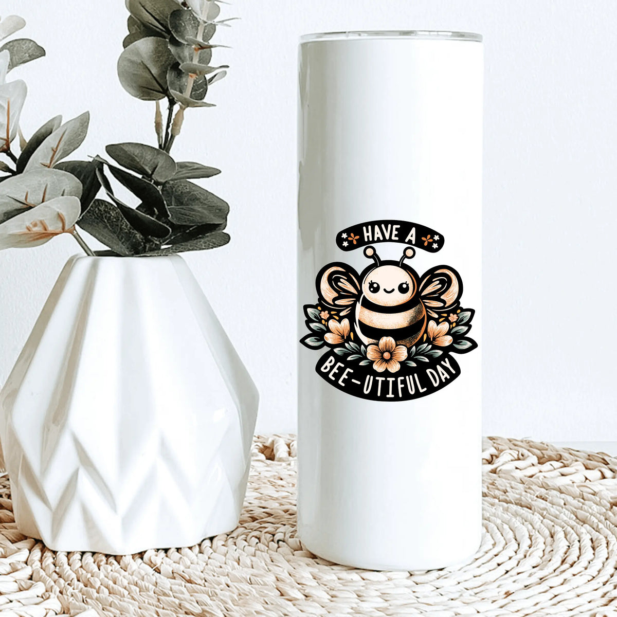 Winks Design Studio LLC R & R 20oz tumbler with multiple colorful designs, stainless steel body, and spill-proof lid.