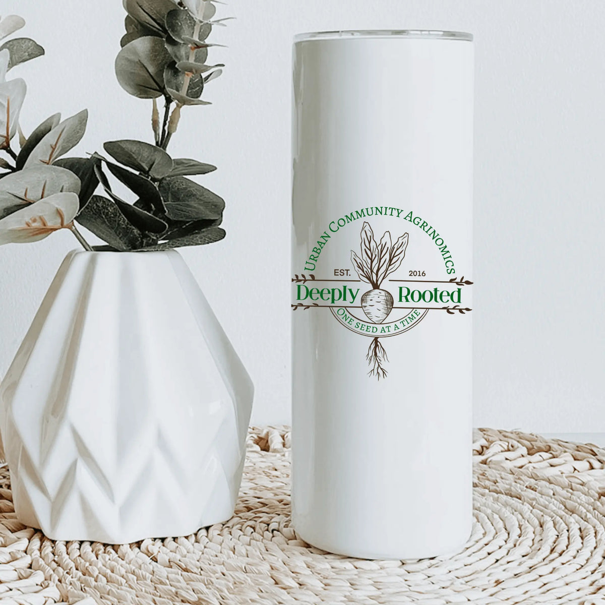 Winks Design Studio LLC UCAN 20oz tumbler with black lid and stainless steel body, designed for hot and cold beverages.