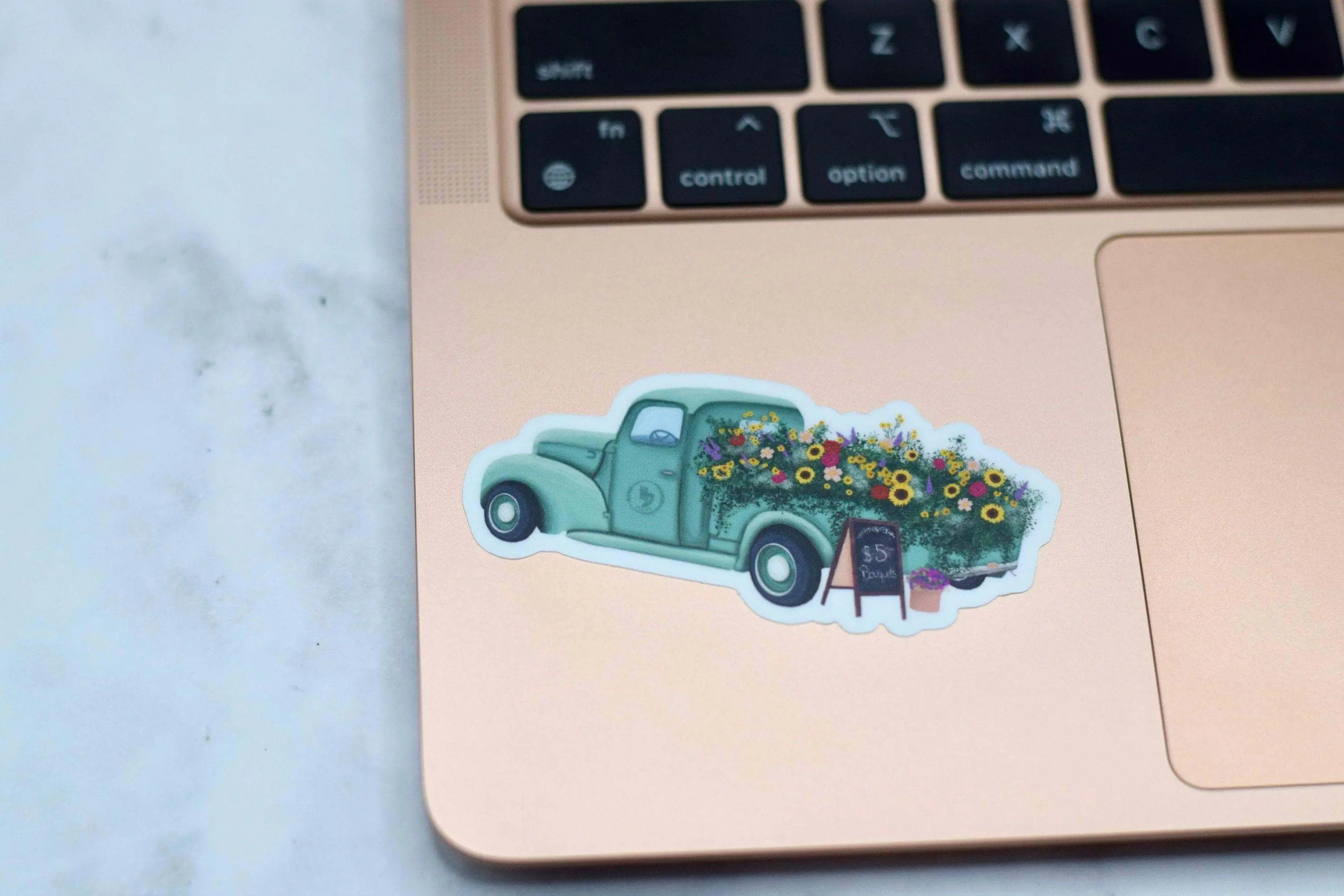 Antique flower truck vinyl sticker from Winks Design Studio, LLC, measuring 1.25x3 inches, featuring detailed floral truck design.