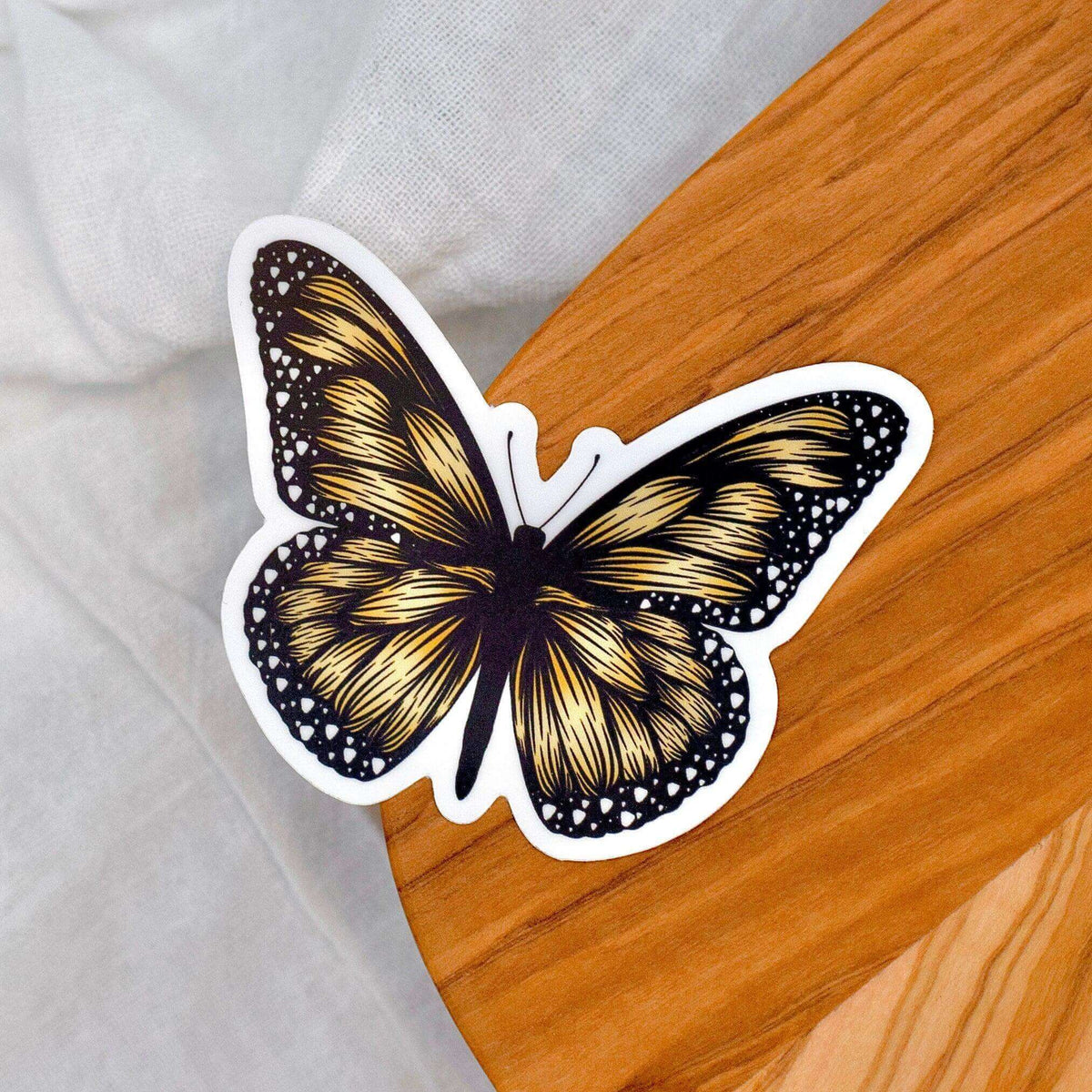 Boho Monarch Butterfly Vinyl Sticker by Winks Design Studio, LLC featuring colorful butterfly design on transparent background.