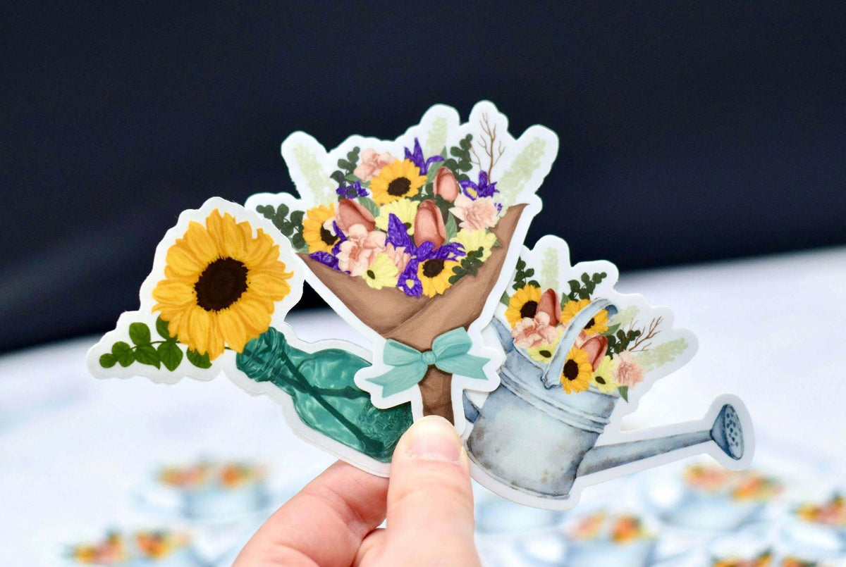 Colorful flower bouquet vinyl sticker by Winks Design Studio, LLC, showcasing vibrant floral design on a clear backing.