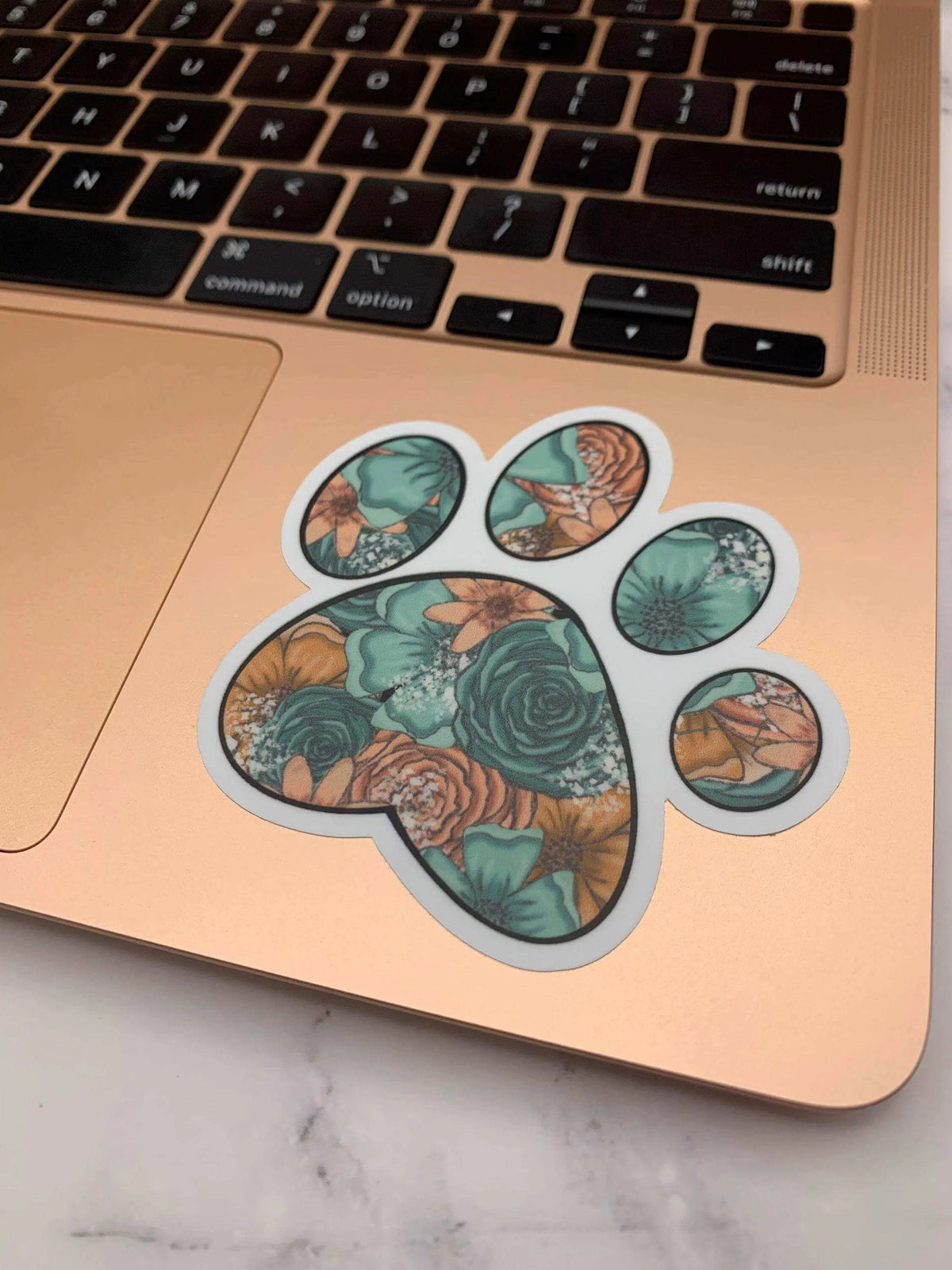 Vinyl paw print sticker by Winks Design Studio, LLC, measuring 3x3 inches, featuring a realistic paw print design.