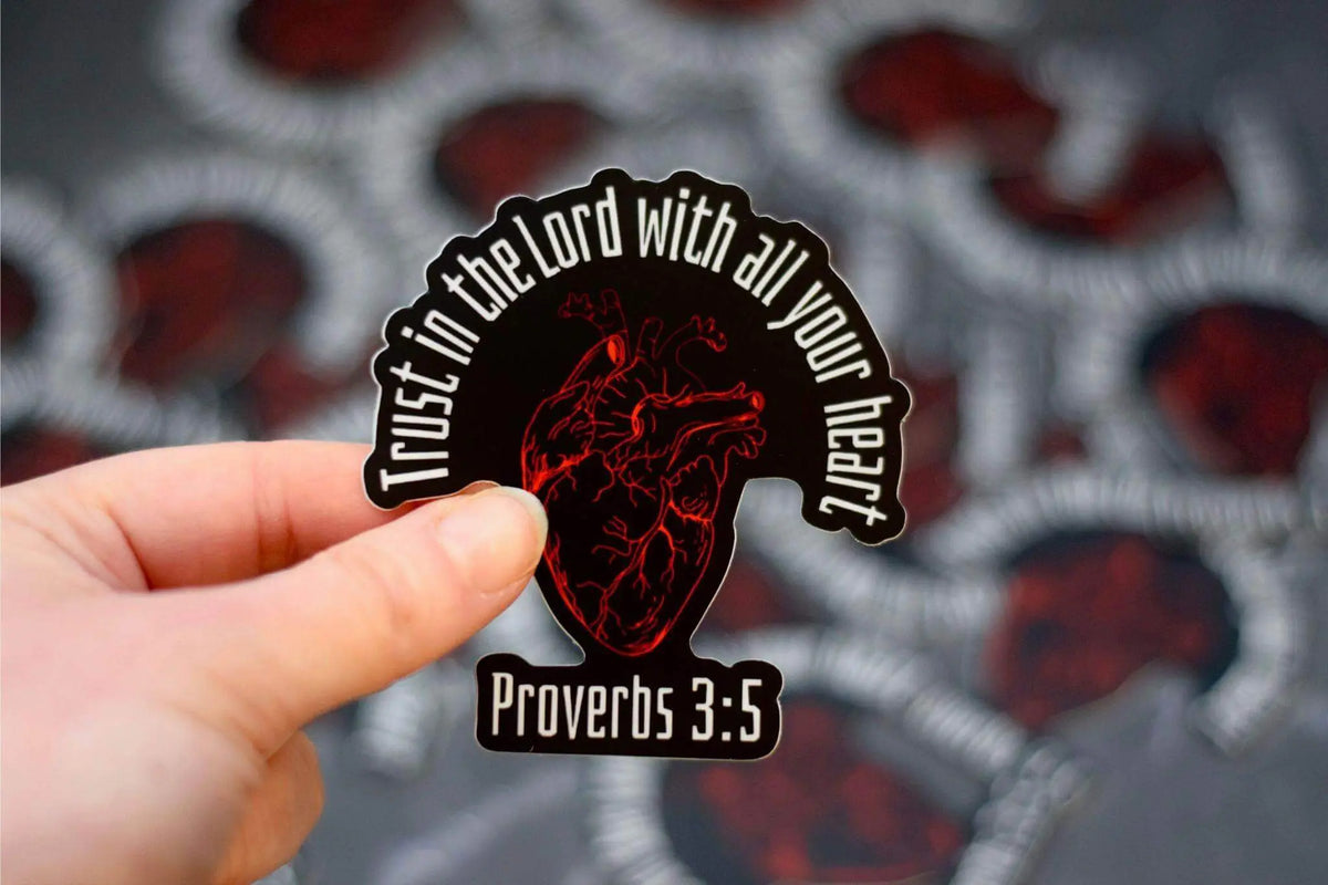 Proverbs 3:5 vinyl sticker featuring an anatomical heart design by Winks Design Studio, LLC, with inspirational scripture and detailed artwork.