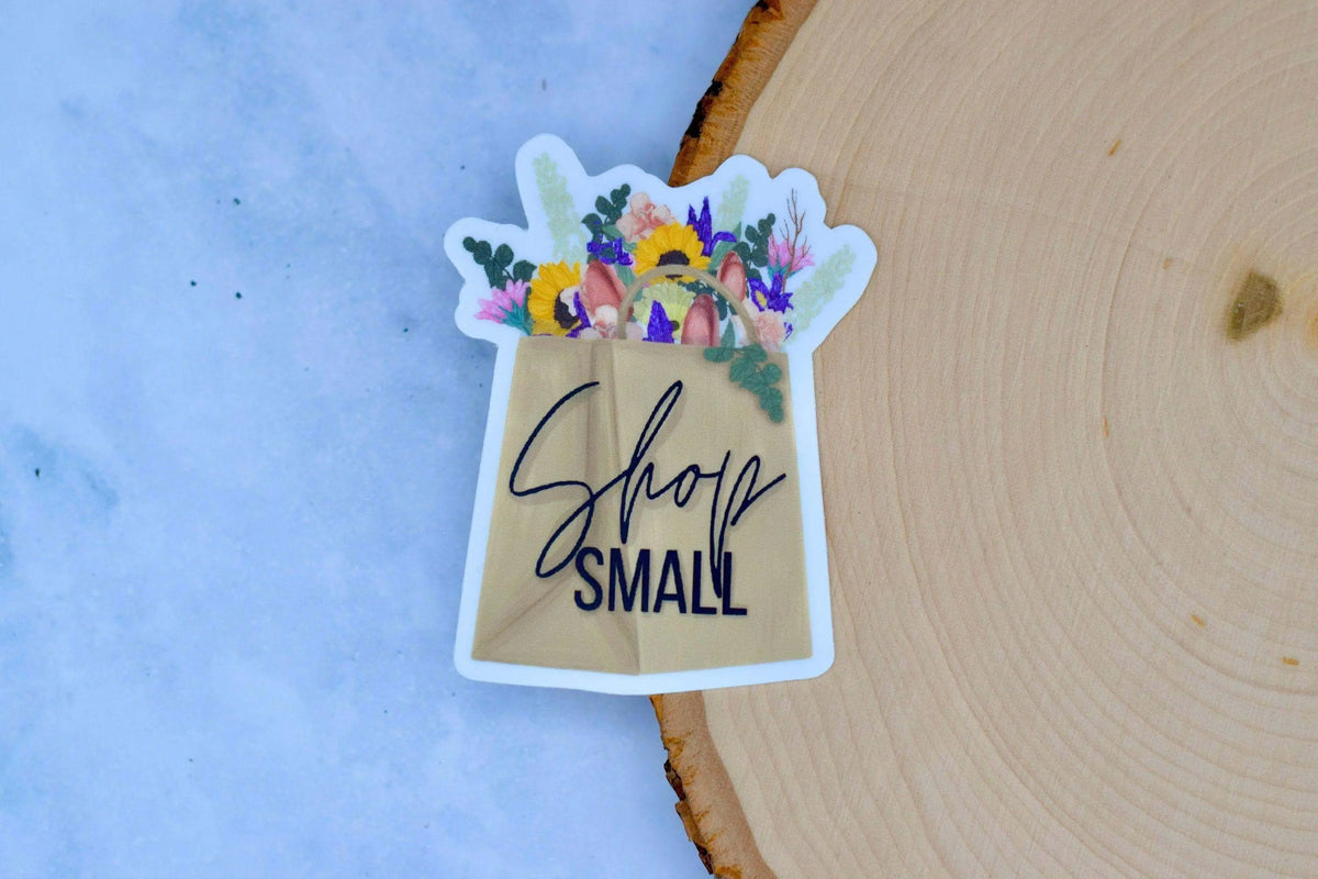 Winks Design Studio LLC vinyl sticker with "Shop Small" text in a simple, bold design on a white background.