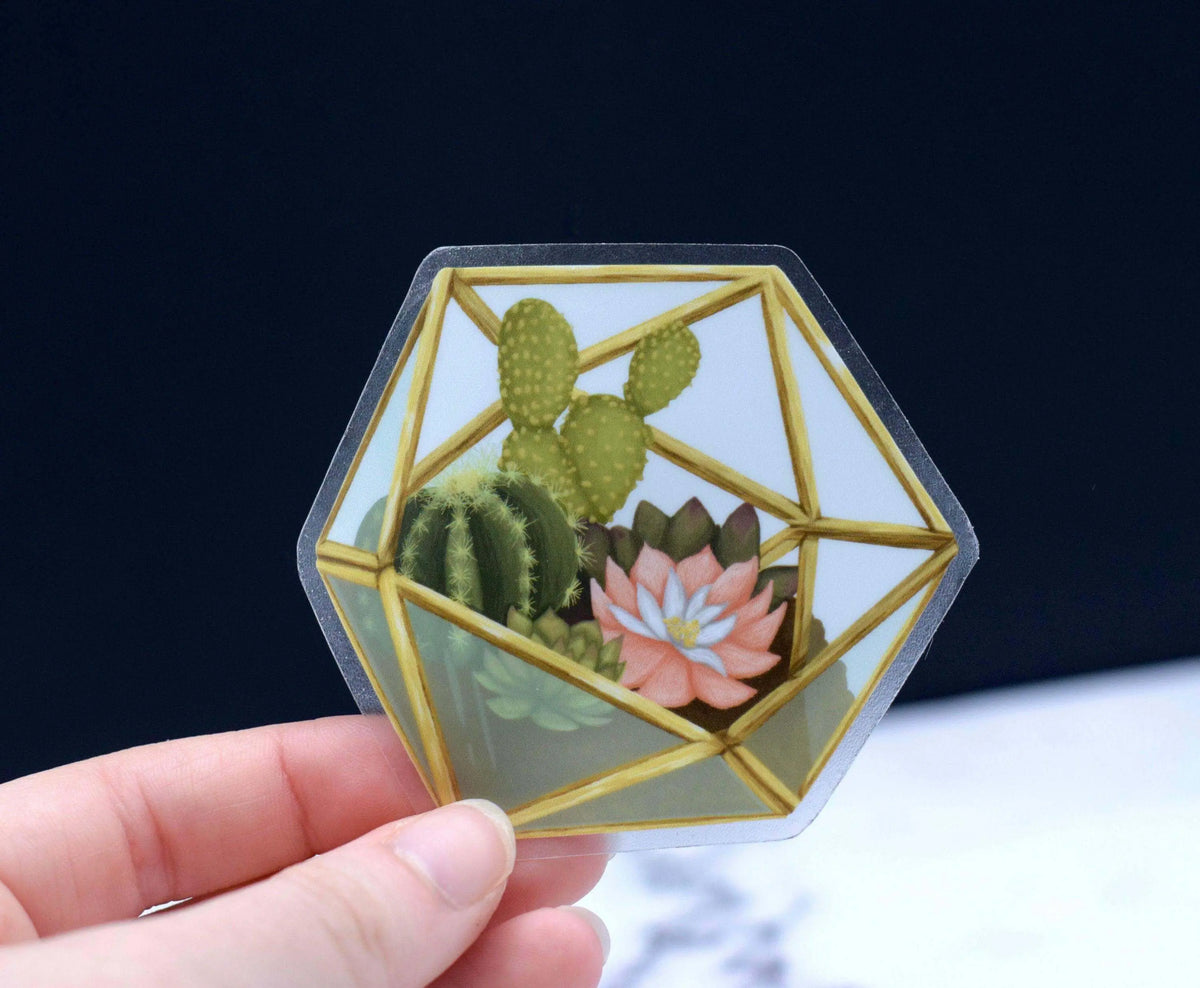 Vinyl succulent terrarium sticker featuring green succulents in a glass container, designed by Winks Design Studio, LLC.