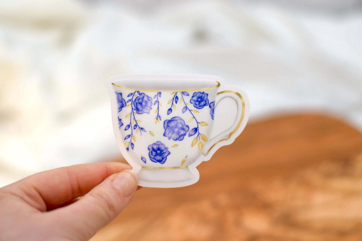 Set of colorful vinyl tea party stickers by Winks Design Studio, LLC featuring teacups, teapots, and sweets for decorating.