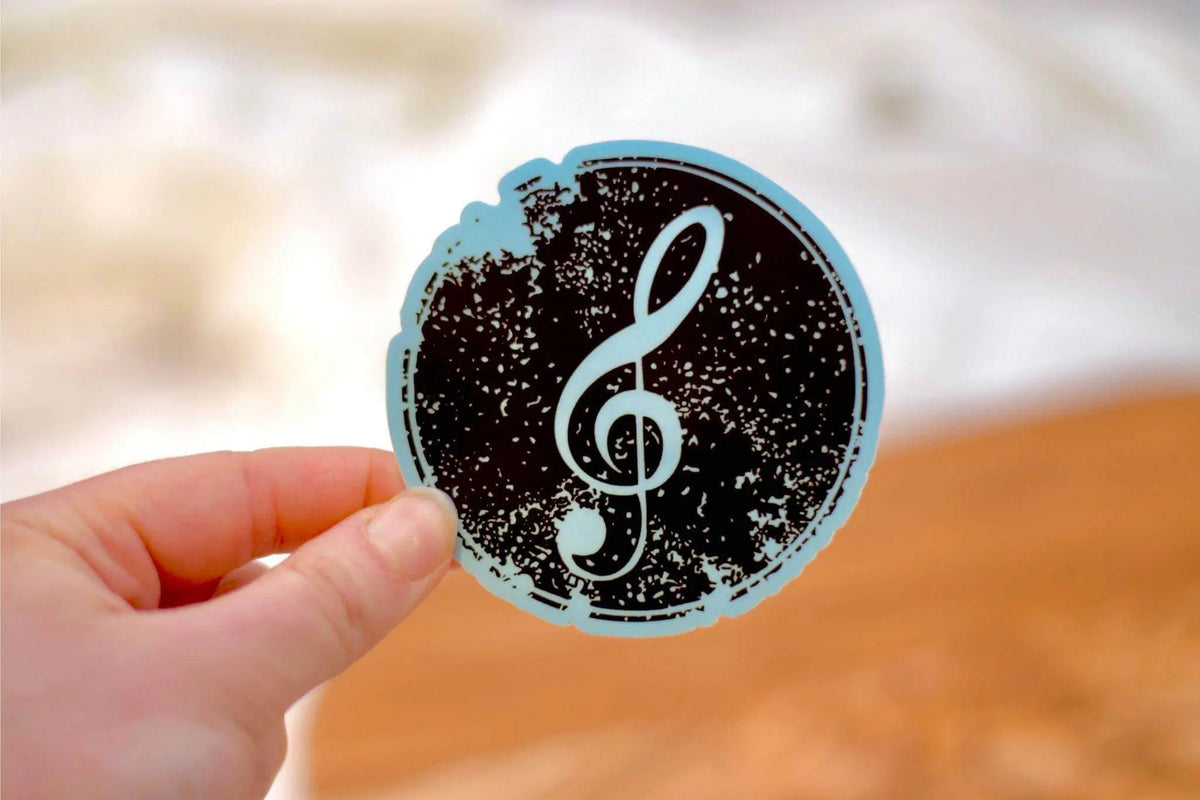 Treble clef music vinyl sticker from Winks Design Studio, LLC, with a detailed treble clef design on a transparent background.