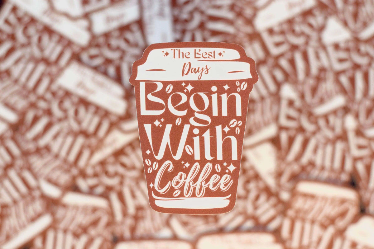 Vinyl sticker from Winks Design Studio featuring the phrase "The Best Days Begin with Coffee" in stylish lettering.