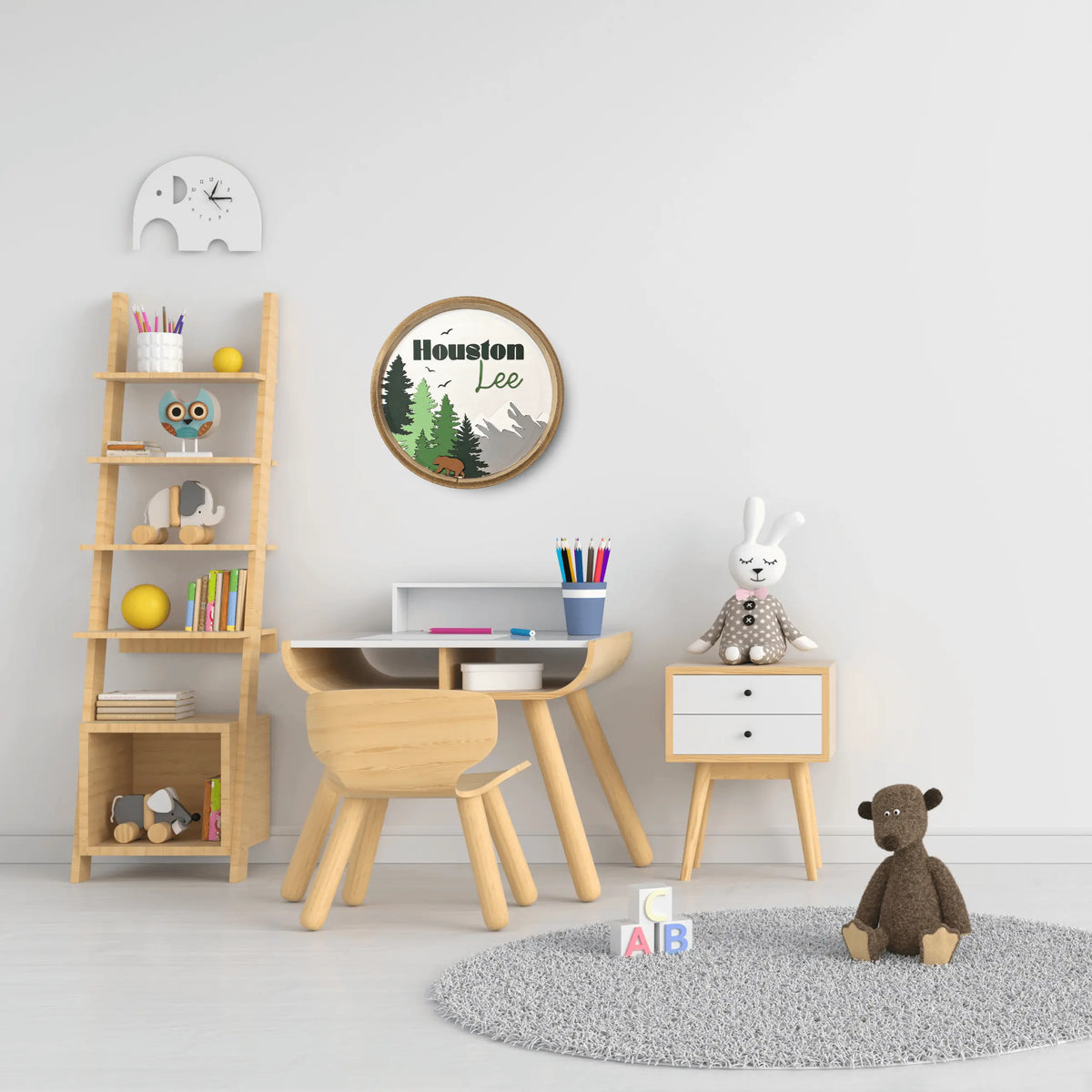 Woodland Creatures Nursery Sign wall art by Winks Design Studio, LLC, featuring handprinted woodland animals on round wall decor.