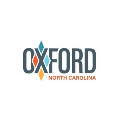 Oxford North Carolina text logo in peach and green colors.